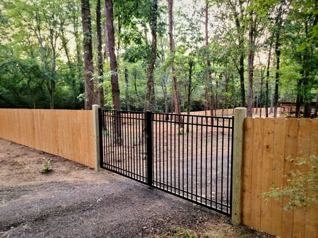 Aluminum Gate in a Wood Fence