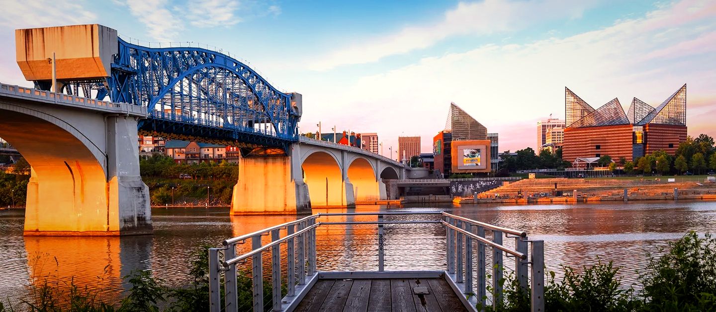 Market Street Bridge over the Tennessee River and the Tennessee Aquarium in downtown Chattanooga at sunset