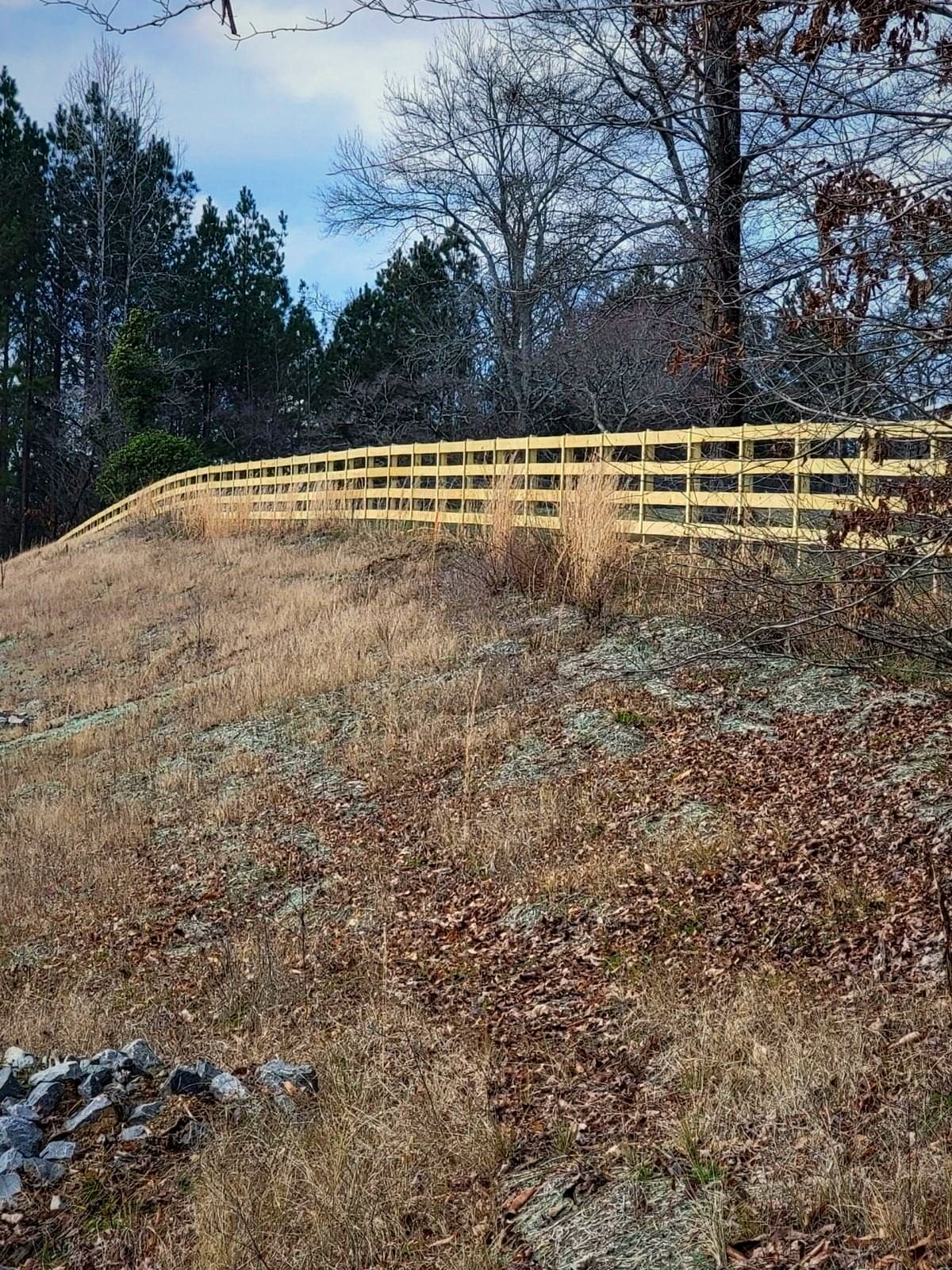 Wood rail fence on a hillside