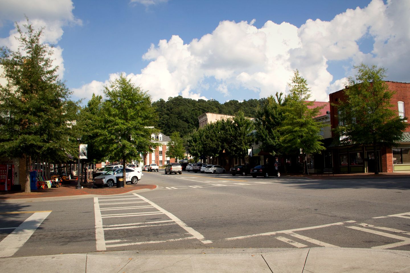 Tree-lined storefronts and a crosswalk in the Calhoun Downtown Historic District, Georgia