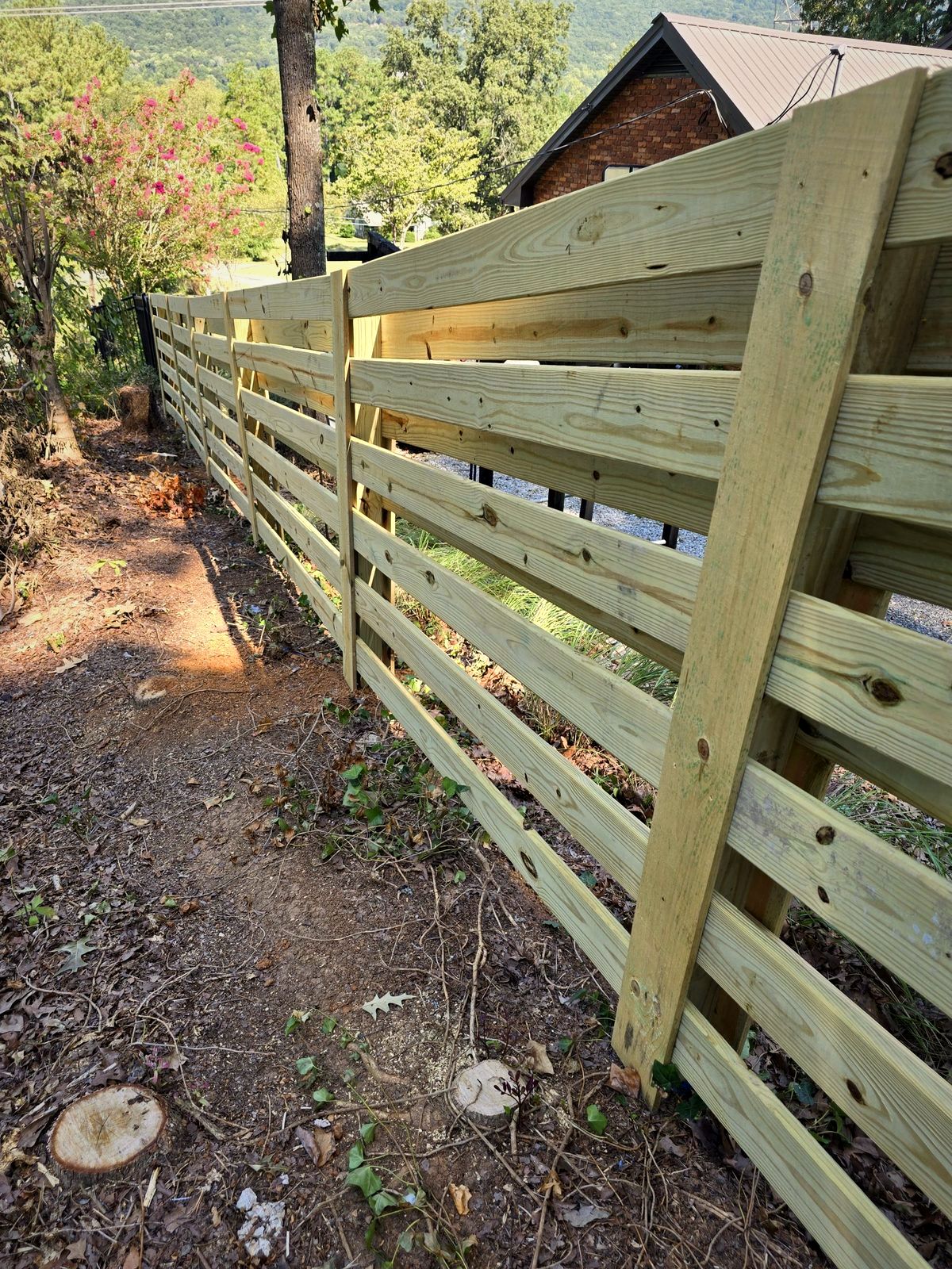 Four-board horizontal wood fence