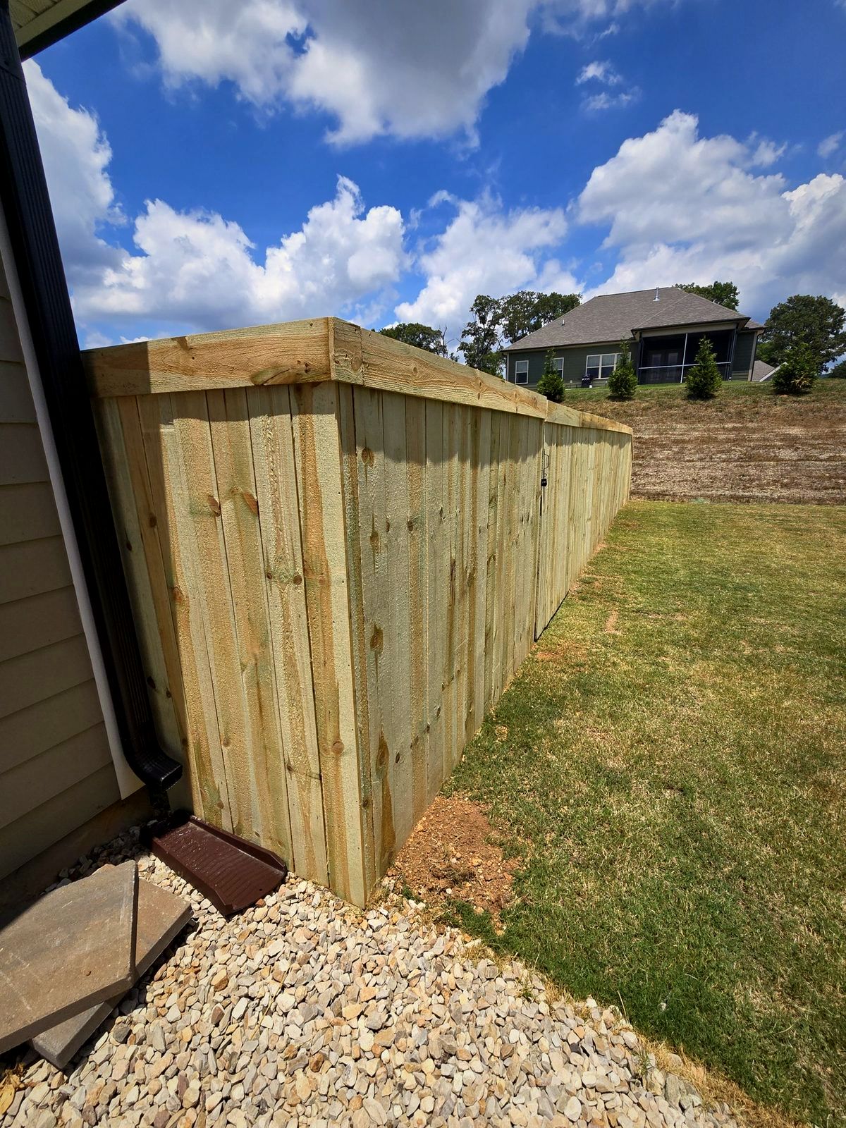 New wood privacy fence along a backyard